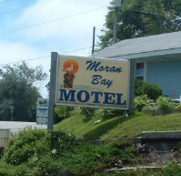 Moran Bay Motel sign next to road