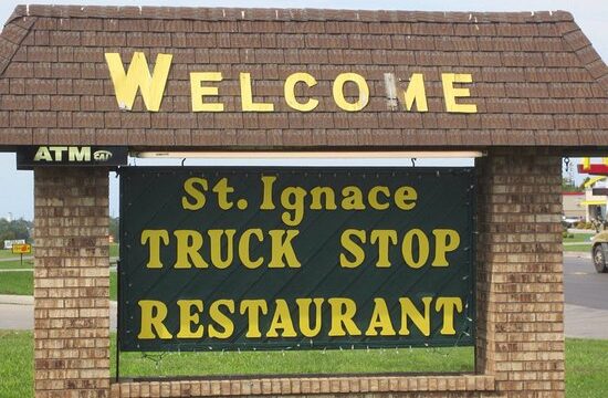 St Ignace Truck Stop sign by the road